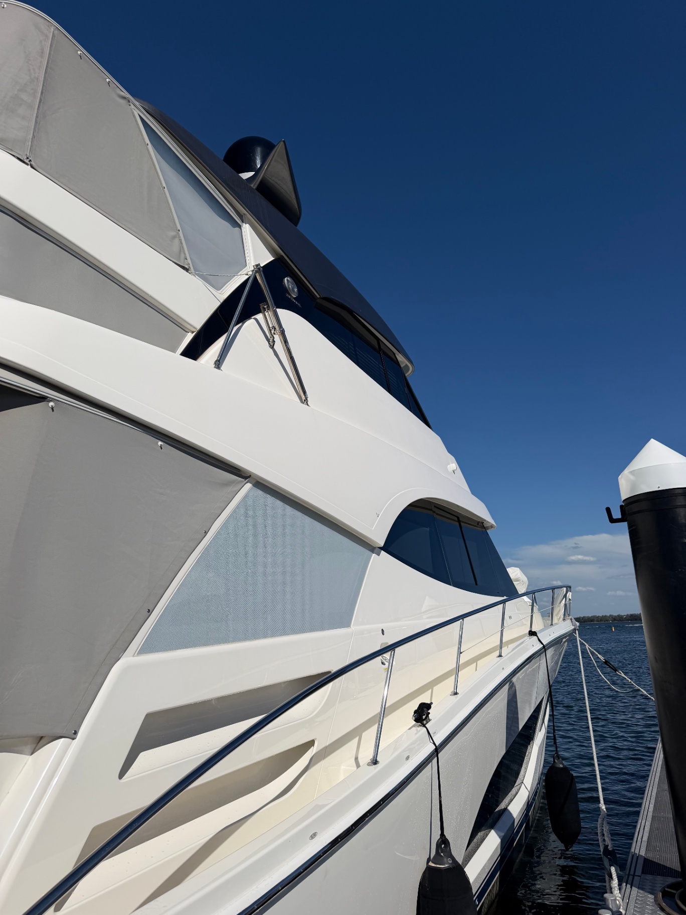 Side profile of a luxury flybridge yacht